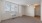 a room with a window and ceiling fan